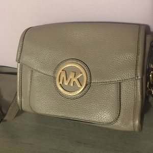 Micheal Kors taupe crossbody bag.